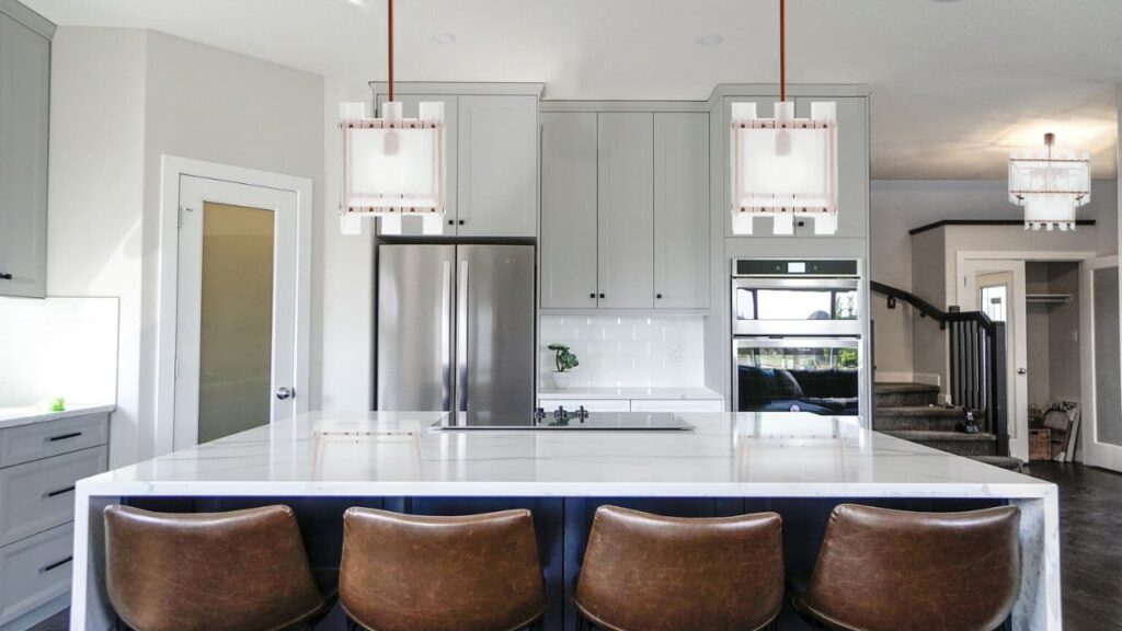 open space kitchen lighting with pendants and designer chandelier